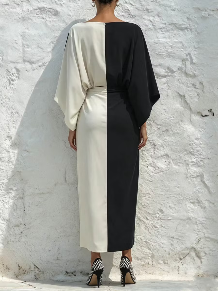 Two-piece set with a contrasting white and black top and midi skirt